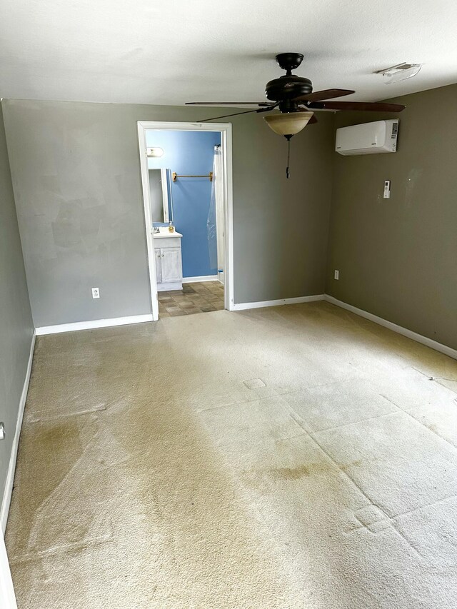 219 Igou Ferry Rd, Soddy Daisy, TN 37379 - unfurnished room featuring a wall unit AC, ceiling fan, carpet flooring, and baseboards