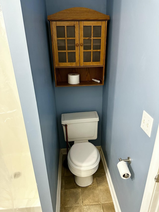 219 Igou Ferry Rd, Soddy Daisy, TN 37379 - bathroom featuring toilet and baseboards