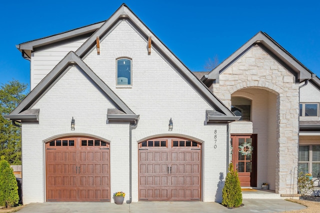 8870 Silver Maple Dr, Ooltewah, TN 37363 - french country style house with brick siding and driveway