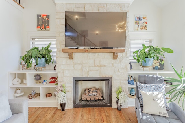 8870 Silver Maple Dr, Ooltewah, TN 37363 - living area with wood finished floors and a fireplace