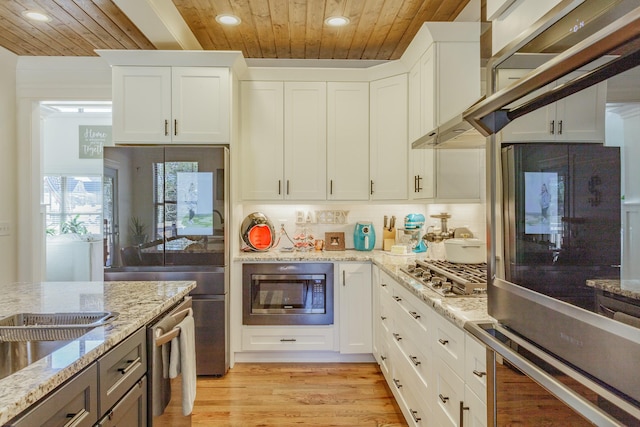 8870 Silver Maple Dr, Ooltewah, TN 37363 - kitchen with appliances with stainless steel finishes, wood ceiling, recessed lighting, light stone counters, and white cabinetry