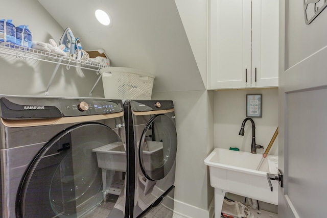 8870 Silver Maple Dr, Ooltewah, TN 37363 - laundry room with washing machine and dryer, cabinet space, tile patterned flooring, and baseboards