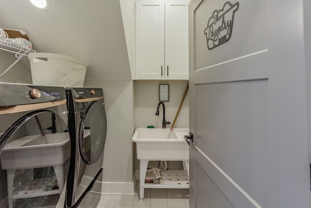 8870 Silver Maple Dr, Ooltewah, TN 37363 - washroom featuring separate washer and dryer, cabinet space, and baseboards