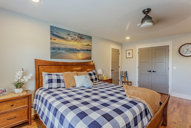 8870 Silver Maple Dr, Ooltewah, TN 37363 - bedroom with wood finished floors, recessed lighting, baseboards, and a closet