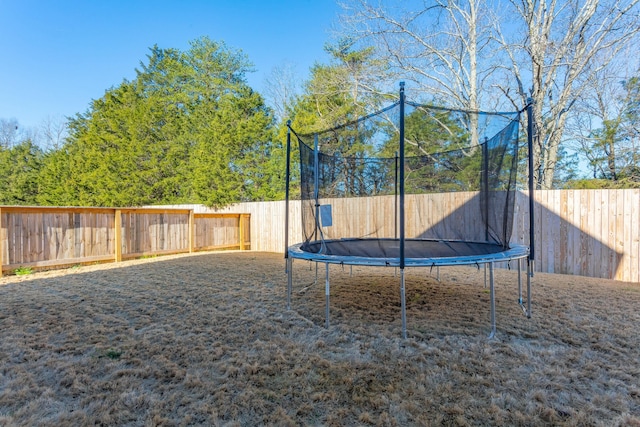 8870 Silver Maple Dr, Ooltewah, TN 37363 - fenced backyard featuring a trampoline