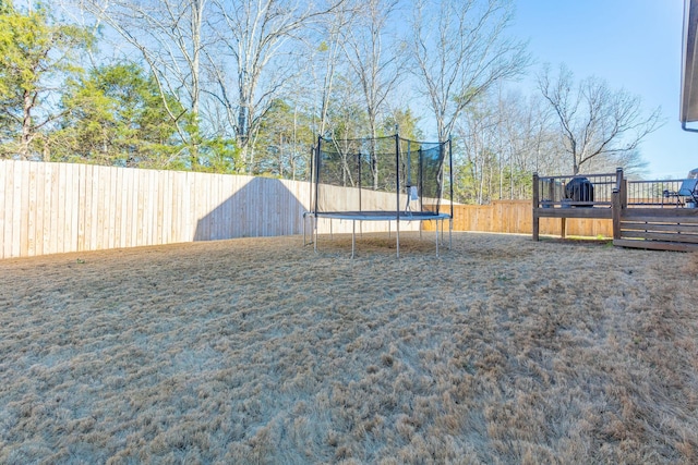 8870 Silver Maple Dr, Ooltewah, TN 37363 - view of yard featuring a trampoline and a deck