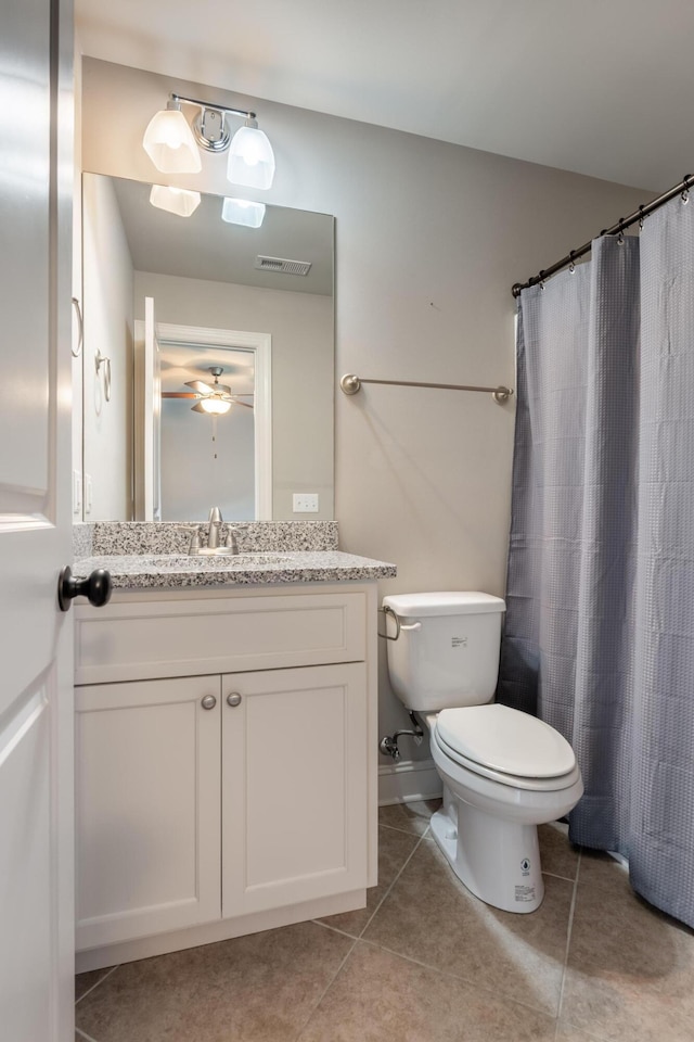 1676 Westover Ln, Chattanooga, TN 37405 - full bath featuring vanity, toilet, tile patterned flooring, and a ceiling fan