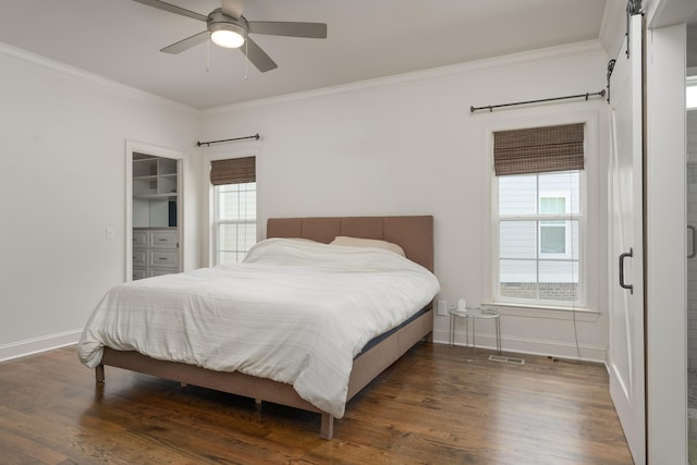 1676 Westover Ln, Chattanooga, TN 37405 - bedroom featuring a barn door, crown molding, dark wood finished floors, baseboards, and ceiling fan