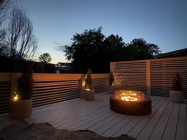 2617 Wendell Way, Chattanooga, TN 37421 - deck at dusk featuring an outdoor fire pit