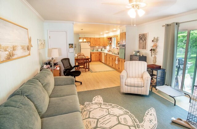 4022 Belvoir Pines Dr, Chattanooga, TN 37412 - living room featuring ceiling fan, crown molding, and light wood-style flooring