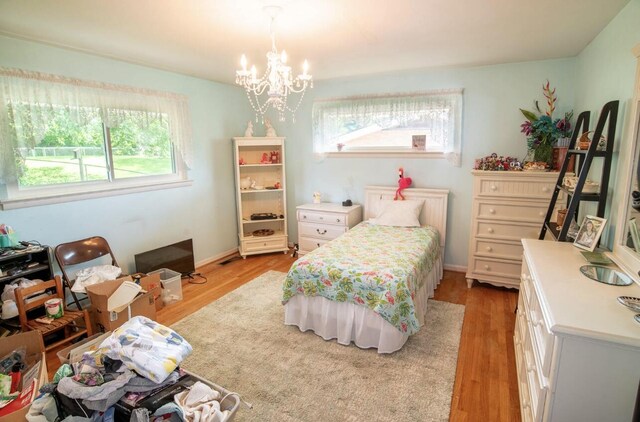 4022 Belvoir Pines Dr, Chattanooga, TN 37412 - bedroom with a chandelier and light wood finished floors