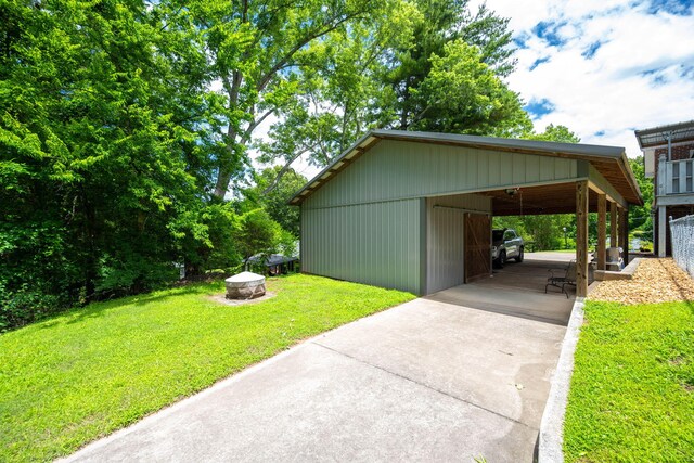 186 Mark Dr, Flintstone, GA 30725 - view of grassy yard featuring driveway, a carport, an outdoor structure, and an outbuilding
