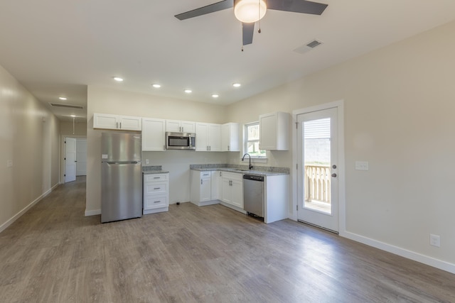 4327 Cronan Dr, Cohutta, GA 30710 - kitchen featuring stainless steel appliances, ceiling fan, light wood-style floors, white cabinets, and recessed lighting