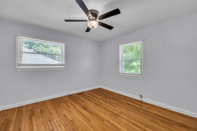 1427 Elm St, Chattanooga, TN 37415 - empty room with baseboards, plenty of natural light, light wood-type flooring, and a ceiling fan