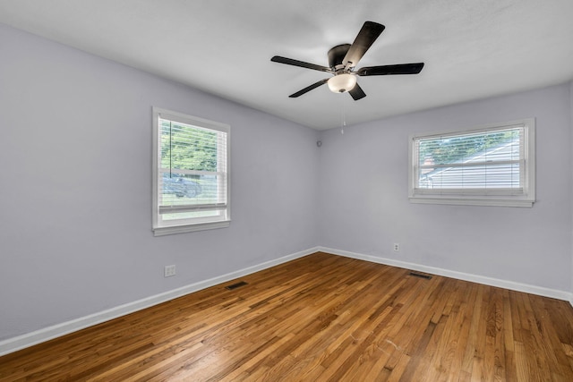 1427 Elm St, Chattanooga, TN 37415 - spare room featuring baseboards, hardwood / wood-style floors, and ceiling fan