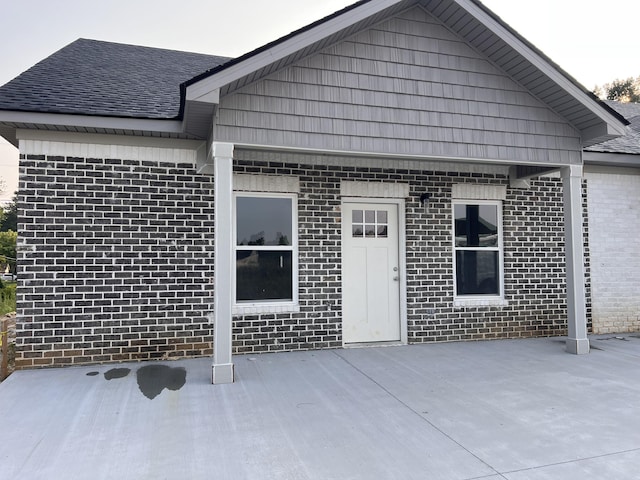 35 Avery Ln Unit 3, Ringgold, GA 30736 - back of house with brick siding, a patio, and roof with shingles