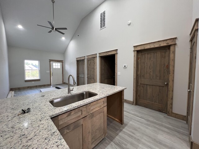 35 Avery Ln Unit 3, Ringgold, GA 30736 - kitchen featuring a sink, high vaulted ceiling, a ceiling fan, light wood-style flooring, and baseboards