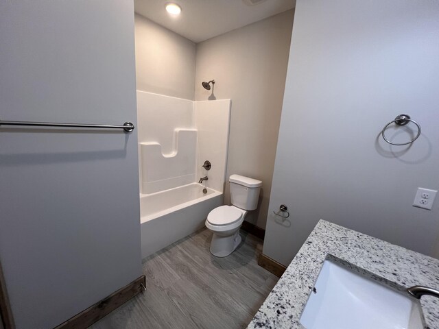 35 Avery Ln Unit 3, Ringgold, GA 30736 - full bath featuring toilet, vanity, bathtub / shower combination, baseboards, and wood finished floors