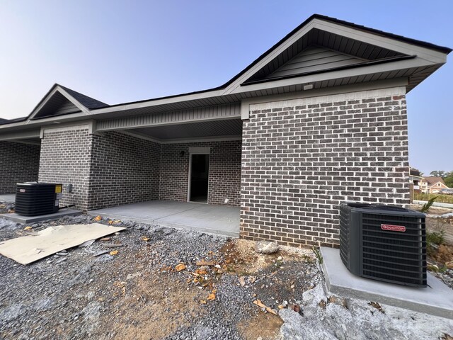 35 Avery Ln Unit 3, Ringgold, GA 30736 - view of side of home with cooling unit and brick siding