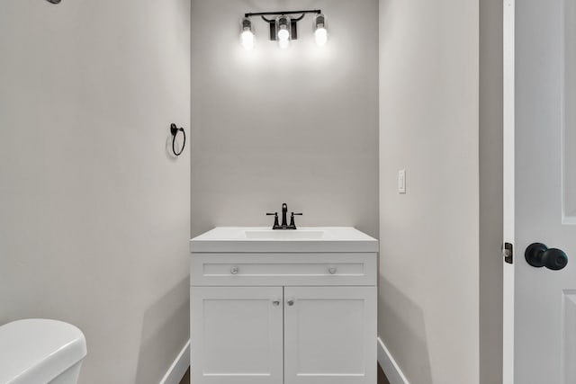 6009 Arlena Cir, Chattanooga, TN 37421 - half bathroom featuring toilet, baseboards, and vanity