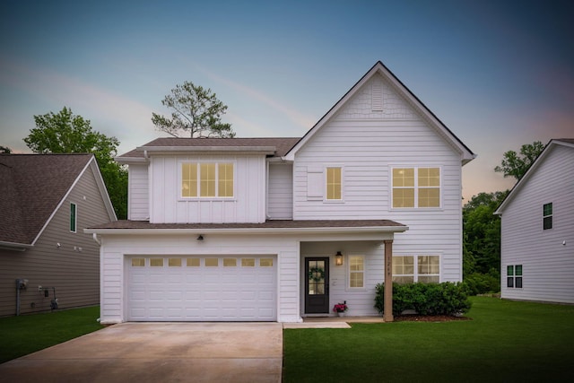 1269 Baldwin Field Cir, Hixson, TN 37343 - view of front of property with board and batten siding, concrete driveway, a yard, and a garage