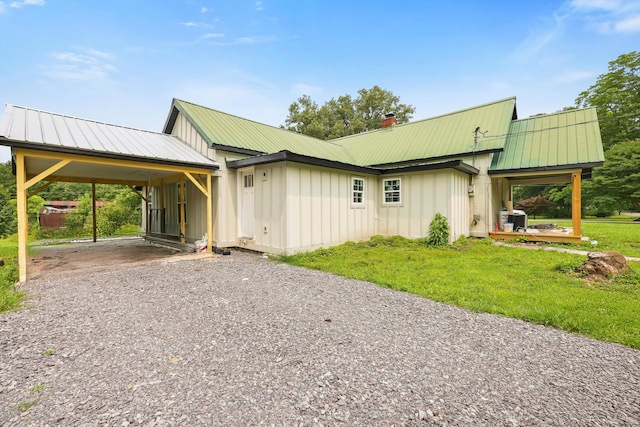760 Keith Rd SE, Dalton, GA 30721 - view of front facade with board and batten siding, driveway, a chimney, and metal roof