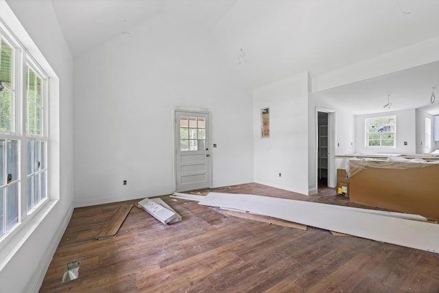 760 Keith Rd SE, Dalton, GA 30721 - unfurnished living room with healthy amount of natural light, wood finished floors, baseboards, and high vaulted ceiling