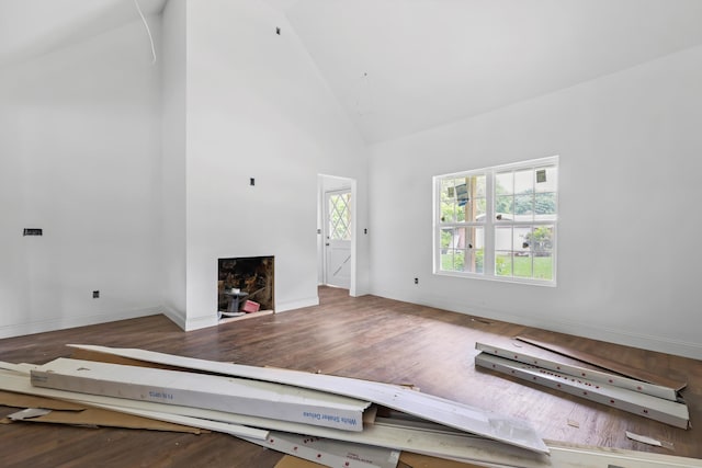 760 Keith Rd SE, Dalton, GA 30721 - unfurnished living room featuring high vaulted ceiling, wood finished floors, and baseboards