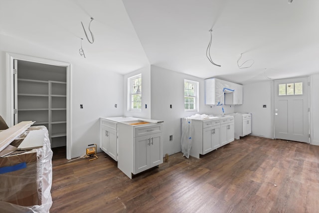 760 Keith Rd SE, Dalton, GA 30721 - kitchen with dark wood-style flooring, light countertops, and white cabinetry