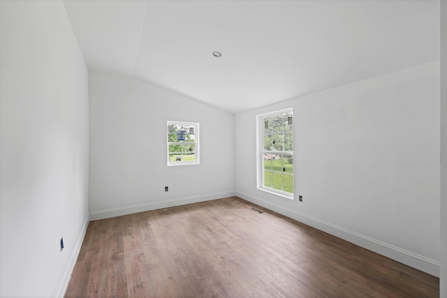 760 Keith Rd SE, Dalton, GA 30721 - unfurnished room featuring lofted ceiling, wood finished floors, and baseboards