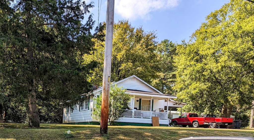 721 W James St, Rossville, GA 30741 - view of front of property featuring a porch