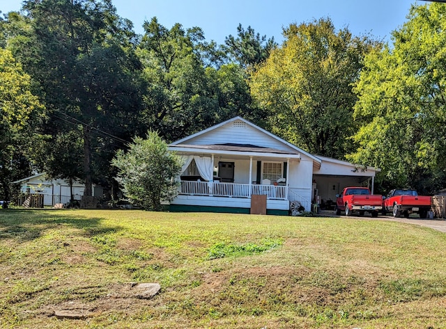 721 W James St, Rossville, GA 30741 - view of front of home with a porch, a front lawn, and driveway