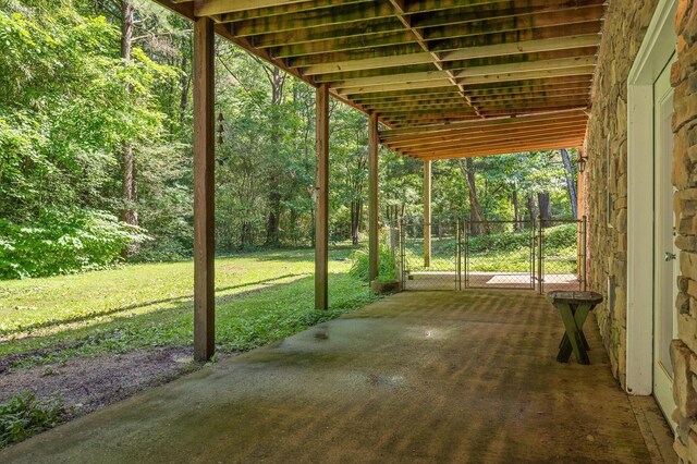 204 Chapman Ct, Lafayette, GA 30728 - view of patio featuring a gate and a wooded view