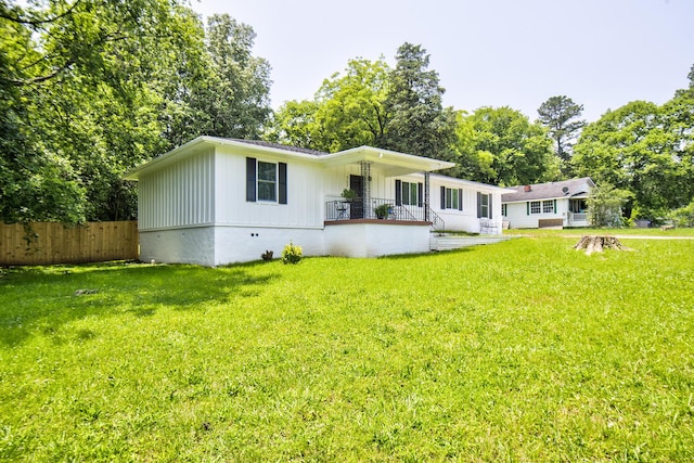 717 W James St, Rossville, GA 30741 - view of front of house with board and batten siding, a porch, and view of wooded area