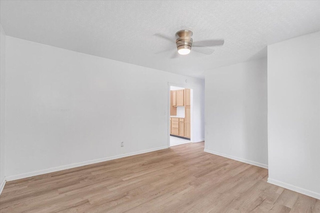 536 Sequatchie Ln, Sequatchie, TN 37374 - empty room with a ceiling fan, light wood-style floors, baseboards, and a textured ceiling