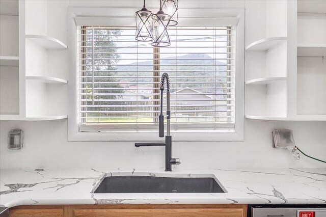 536 Sequatchie Ln, Sequatchie, TN 37374 - kitchen with open shelves, a sink, light stone counters, and dishwasher