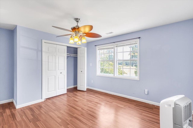 536 Sequatchie Ln, Sequatchie, TN 37374 - unfurnished bedroom featuring wood finished floors, baseboards, a closet, and ceiling fan