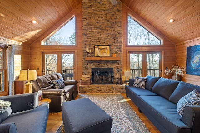 292 Log Cabin Ln Unit 14, Dunlap, TN 37327 - living area with high vaulted ceiling, wooden ceiling, wood finished floors, a stone fireplace, and wooden walls