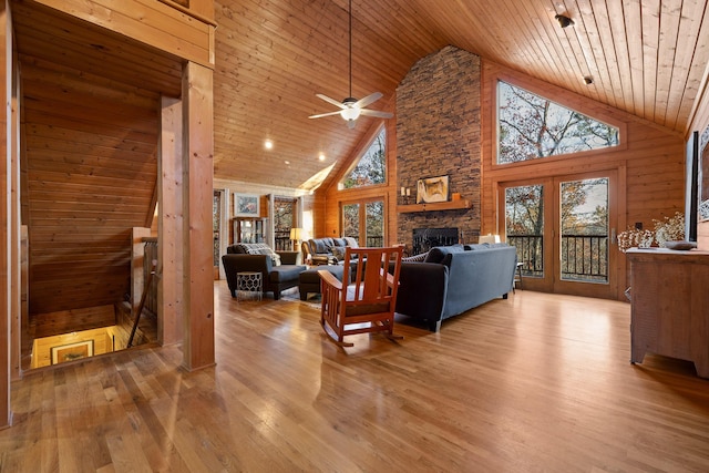 292 Log Cabin Ln Unit 14, Dunlap, TN 37327 - living room featuring wood ceiling, high vaulted ceiling, ceiling fan, wood finished floors, and a stone fireplace