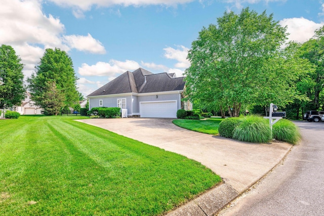 902 Cattails Dr, Ooltewah, TN 37363 - view of front of home with a front yard, an attached garage, and concrete driveway