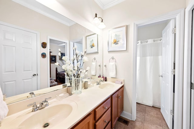 902 Cattails Dr, Ooltewah, TN 37363 - ensuite bathroom featuring ornamental molding, double vanity, tile patterned flooring, and baseboards