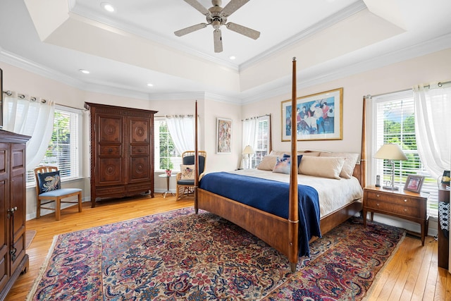 902 Cattails Dr, Ooltewah, TN 37363 - bedroom with a raised ceiling, light wood-style floors, crown molding, recessed lighting, and ceiling fan