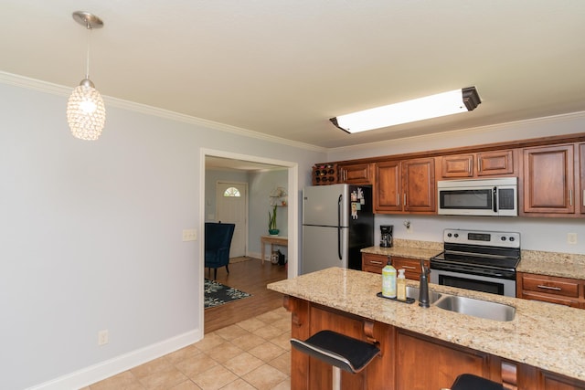 3613 Altamira Dr, Chattanooga, TN 37412 - kitchen featuring stainless steel appliances, crown molding, a breakfast bar, pendant lighting, and brown cabinetry