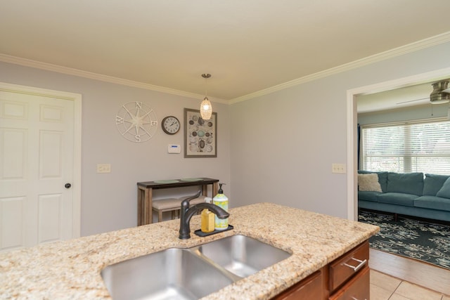 3613 Altamira Dr, Chattanooga, TN 37412 - kitchen featuring crown molding, pendant lighting, light stone countertops, brown cabinets, and light tile patterned floors