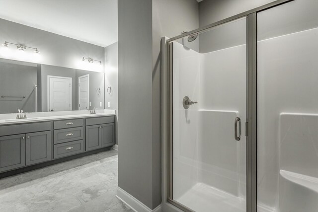 1811 Oakvale Dr, Chattanooga, TN 37421 - bathroom featuring double vanity, baseboards, a stall shower, and marble finish floors