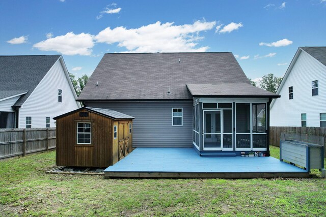 1811 Oakvale Dr, Chattanooga, TN 37421 - back of house with a sunroom, a wooden deck, and roof with shingles