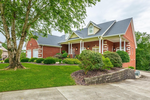 9548 Shadow Crossing Ln, Chattanooga, TN 37421 - view of front of property with brick siding, a front lawn, a garage, and roof with shingles