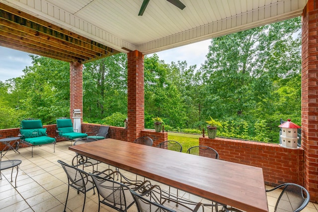 9548 Shadow Crossing Ln, Chattanooga, TN 37421 - view of patio with outdoor dining space, ceiling fan, and view of wooded area