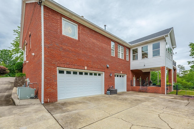 9548 Shadow Crossing Ln, Chattanooga, TN 37421 - rear view of house with brick siding, driveway, and an attached garage
