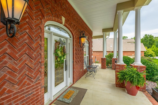 9548 Shadow Crossing Ln, Chattanooga, TN 37421 - view of exterior entry with a porch and brick siding